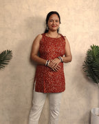 Rust Red Bandhani Ring Print Rayon Sleeveless Short Kurti
